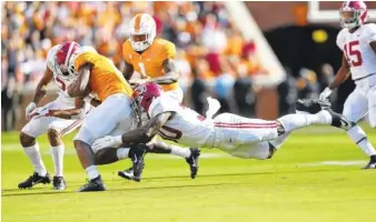  ?? KENT GIDLEY/ALABAMA PHOTO ?? Alabama inside linebacker Mack Wilson (30) helped the Crimson Tide win their 80th consecutiv­e game against an unranked opponent last Saturday with the 58-21 triumph at Tennessee.