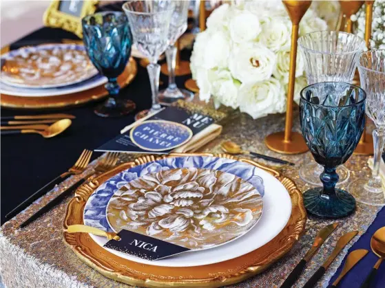 ??  ?? “Exquisite dinnerware and flatware, courtesy of Casa Luxia, makeup the rest of the table setting”. 01 ABOVE