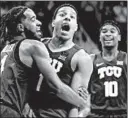  ?? RICHARD RODRIGUEZ/AP ?? TCU’s Desmond Bane is hugged by PJ Fuller after hitting a 3-pointer.