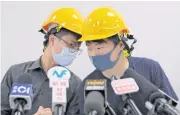  ?? AP ?? Protesters Jerry Chan, right, chats with Linus Kim during a press conference in Hong Kong yesterday.