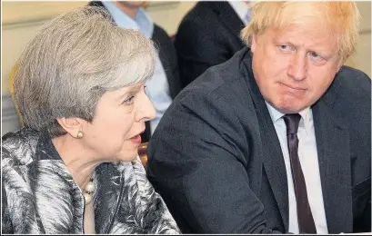  ??  ?? Theresa May at the Cabinet’s first meeting since the election yesterday as Boris Johnson looks on