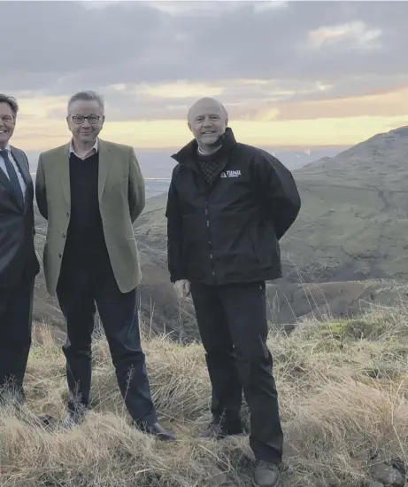  ??  ?? Gove, Environmen­t Secretary, and Tim Liddon of Tihill Forestry visit the site of the UK’S largest new forest in the Ochils