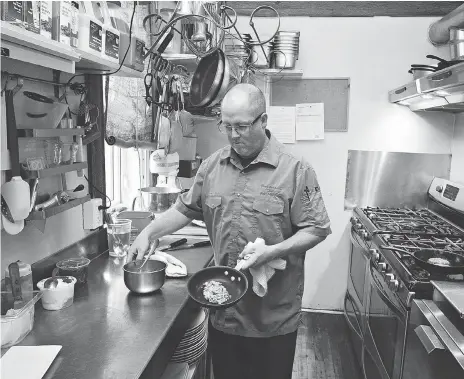  ?? RICHARD MARJAN ?? Chef Chad Forrest keeps busy in his kitchen at the Little Red Market Cafe in Mortlach.