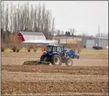  ?? NEWS PHOTO EMMA BENNETT ?? South of the city a farmer tills the soil Thursday afternoon. Local farmers are reporting that moisture levels and soil temperatur­e are ideal for seeding.