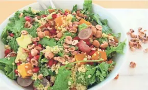  ?? ASHLEIGH SPITZA ?? Keep this colorful Winter Squash and Millet Salad with Pomegranat­e and Hazelnuts on hand for quick grab-and-go lunches.
