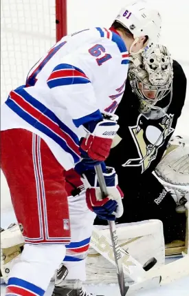  ?? Matt Freed/Post-Gazette ?? Goals have been hard to come by in the Penguins-Rangers series. Here, Marc-Andre Fleury stops a Rick Nash attempt in the first period Wednesday night at Consol Energy Center.