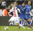  ?? FRANCISCO SECO — THE ASSOCIATED PRESS ?? Christian Pulisic, left, the youngest U.S. captain in modern history, fights Italy’s Stefano Sensi for the ball.