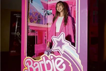  ?? Photos by Benjamin Fanjoy/Special to the Chronicle 2023 ?? Krizzia Koh stands in a life-size Barbie display at the AMC Metreon 16 in San Francisco. Last summer’s pink Barbiemani­a put people in seats at movie theaters throughout the country.