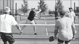  ?? HERALD FILE PHOTO ?? Russ Campbell and Bill Loran take on Vern Dundas and Steve Meszaros in a game of pickleball at Legacy Park.