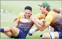  ?? (AP) ?? South Africa’s Herschel Jantjies is grabbed by teammate Eben Etzebeth during a training session in Tokyo, Japan on Oct 17. South Africa play
Japan in a Rugby World Cup quarter-final on Oct 20.