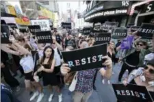  ?? FRANK FRANKLIN II - THE ASSOCIATED PRESS ?? Protestors gather in Times Square, Wednesday, in New York. President Donald Trump declared a ban Wednesday on transgende­r troops serving anywhere in the U.S. military, catching the Pentagon flat-footed and unable to explain what it called Trump’s...