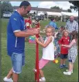  ??  ?? Five-yearold Mia Wallis with her father Adam trying out stilts at a circus workshop Barlestone Fun Day fancy dress competitio­n winners from left, threeyear-old Grace Coats as Goldilocks, seven-year-old Josh Haycock as a ghost pirate, six-year-old Zack...