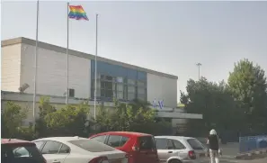  ?? (Marc Israel Sellem/The Jerusalem Post) ?? THE LGBT flag flies yesterday above the Hebrew University Secondary School in Jerusalem, where stabbing victim Shira Banki (below) studied.