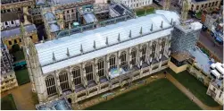  ?? ?? Roofing repairs: King’s College Chapel with scaffoldin­g up