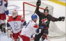  ?? Associated Press ?? Dylan Cozens, right, extends Canada’s lead on Czech Republic at the world junior championsh­ip in Ostrava, Czech Republic.