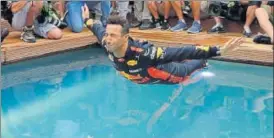  ?? AP ?? Red Bull driver Daniel Ricciardo of Australia dives into a pool after winning the F1 race in Monaco,