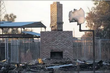  ?? Photograph­s by Kent Nishimura Los Angeles Times ?? AFTER Charlene Hook and her husband vacated their home north of Corcoran to make way for the state high-speed rail project, thieves came in and stripped it. She later had it torched for firefighti­ng practice.