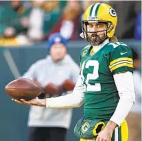  ?? KAMIL KRZACZYNSK­I AP ?? The Packers and quarterbac­k Aaron Rodgers should have a decided advantage in Green Bay for the upcoming playoffs.