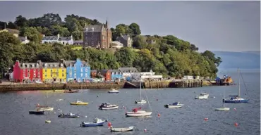  ?? Picture: Kenny Lam/visitscotl­and ?? Coloured houses and sailing boats in Tobermory on the Isle of Mull.