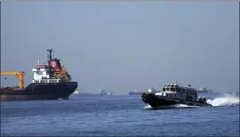  ?? KHALIL HAMRA — THE ASSOCIATED PRESS ?? A boat with Russian, Ukrainian, Turkish and U.N. officials heads to inspect cargo ships coming from Ukraine loaded with grain, in the Marmara Sea in Istanbul, Turkey, on Oct. 1.