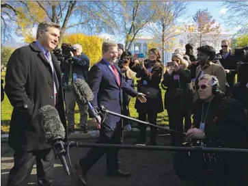  ?? Manuel Balce Ceneta Associated Press ?? CNN’S Jim Acosta, left, returns to the White House after a federal judge ordered the Trump administra­tion to restore his press credential. The White House said it would create guidelines for reporters’ decorum.