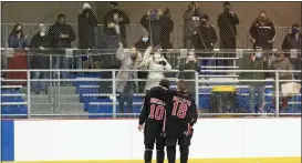  ?? RICH HUNDLEY III — FOR THE TRENTONIAN ?? Robbinsvil­le’s Mitch Ducalo, left, and Charlie Pallitto, right, celebrate toward fans after defeating Notre Dame in the CVC Tournament final at Mercer County Rink on Friday afternoon.