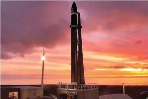  ?? Rocket Lab via AP ?? ■ Rocket Lab’s Electron rocket waits on the launch pad on the Mahia peninsula in New Zealand, on Tuesday. NASA wants to experiment with a new orbit around the moon which it hopes to use in the coming years to once again land astronauts on the lunar surface.