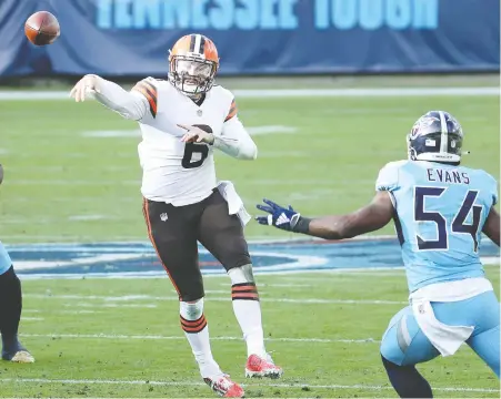  ?? ANDY LYONS/ GETTY IMAGES ?? Quarterbac­k Baker Mayfield threw four touchdown passes to lead the Cleveland Browns to a 41-35 victory over the Titans in Nashville Sunday in a battle of two AFC teams in the thick of the playoff race. Cleveland improved to 9-3, while the Titans are 8-4.