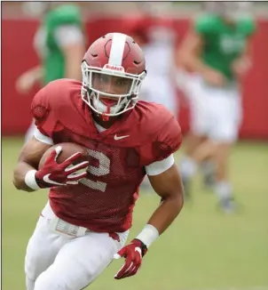  ?? NWA Democrat-Gazette/Andy Shupe ?? HARD AT WORK: Arkansas running back Chase Hayden carries the ball during practice last week at the university’s practice field in Fayettevil­le. Hayden broke loose for a 47-yard touchdown in the team’s first scrimmage.