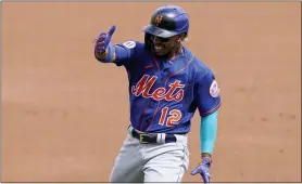  ?? LYNNE SLADKY — THE CANADIAN PRESS VIA AP ?? The Mets’ Francisco Lindor (12) reacts after flying during a spring training game on Monday in West Palm Beach, Fla.