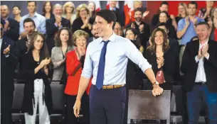  ?? JUSTIN TANG THE CANADIAN PRESS ?? Prime Minister Justin Trudeau framed the Oct. 21 federal election as a choice between the agendas of the Liberals and Conservati­ves during a speech in front of 200 candidates.