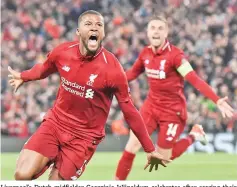  ??  ?? Liverpool’s Dutch midfielder Georginio Wijnaldum celebrates after scoring their third goal during the UEFA Champions league semi-final second leg football match between Liverpool and Barcelona. - AFP photo