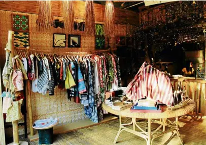  ??  ?? Manggad sells proudly Palawan-made clothes and bags in vibrant colors and prints.