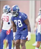  ?? Seth Wenig / Associated Press ?? The New York Giants’ Andrew Thomas (78) participat­es in a practice at the team’s training camp in East Rutherford, N.J., on Wednesday.