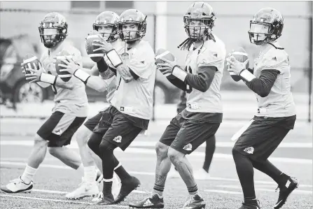  ?? SCOTT GARDNER HAMILTON SPECTATOR FILE PHOTO ?? From left, quarterbac­ks Jeremiah Masoli, Dane Evans, Vernon Adams Jr., Bryant Moniz and Johnny Manziel will all be on the field Friday, just not all on the same team. Manziel will get his first CFL start for the Montreal Alouettes against the Hamilton...