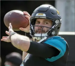  ?? STEPHEN B. MORTON — THE ASSOCIATED PRESS ?? Jaguars quarterbac­k Blake Bortles (5) warms up before the start of an NFL wild-card playoff game against the Buffalo Bills in Jacksonvil­le, Fla.