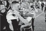  ?? AP/ADAM HUNGER ?? New England Patriots quarterbac­k Tom Brady, left, talks to New York Jets quarterbac­k Sam Darnold after an NFL football game Monday in East Rutherford, N.J.