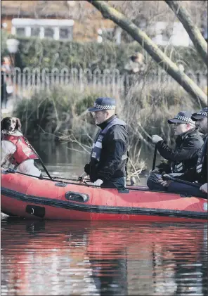  ?? PICTURE: JONATHAN BRADY/PA WIRE. ?? CONCERNS: Police in an inflatable boat with a sniffer dog search a pond on Clapham Common in London for Sarah Everard, 33, originally from York, who vanished last Wednesday evening.
