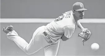  ?? BENNY SIEU/USA TODAY SPORTS ?? Cardinals pitcher Alex Reyes throws a pitch in the first inning against the Brewers at Miller Park.