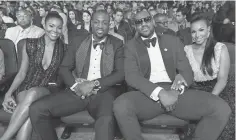  ?? JORDAN STRAUSS, INVISION/ AP ?? NBA stars Dwyane Wade, center left, and LeBron James enjoy the 2013 ESPY Awards in Los Angeles.