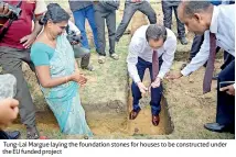  ??  ?? Tung-lai Margue laying the foundation stones for houses to be constructe­d under the EU funded project