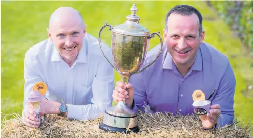  ??  ?? An ice day out Production manager Gary Munro andmanagin­g director David Equi celebrate the big win for Equi’s