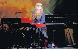  ?? Gary Coronado Los Angeles Times ?? A SMILING Tori Amos accompanie­s herself on keyboards during Sunday show.