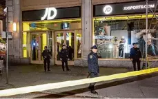 ?? Gardiner Anderson / Tribune News Service ?? Police respond after a woman was shot inside the JD Sports store on Broadway and 41st Street in Times Square on Thursday in New York.