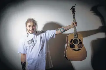  ?? Allen J. Schaben Los Angeles Times ?? “I WAS SO SCARED at first to come out in front of 20,000 people, afraid it would just be crickets,” Post Malone recalled. “But the audience was so supportive. The whole place was singing along to my one good song.”