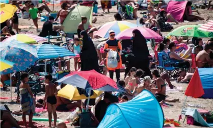  ?? Photograph: Clement Mahoudeau/AFP/Getty ?? Beachgoers in Marseille earlier this week. France’s health minister said: ‘The war is not over … We are going to have to live with this virus for a long time.’