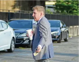  ?? THE ATLANTA JOURNAL-CONSTITUTI­ON ?? Todd Chrisley outside the federal trial court in Atlanta in 2022. He was found liable in a civil slander case brought against him by a Georgia Department of Revenue investigat­or, who was awarded $755,000 by a jury.