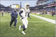  ?? Steven Senne / Associated Press ?? Los Angeles Chargers quarterbac­k Philip Rivers leaves the field after an AFC divisional playoff game against the New England Patriots on Sunday in Foxborough, Mass. The Patriots won 41-28.