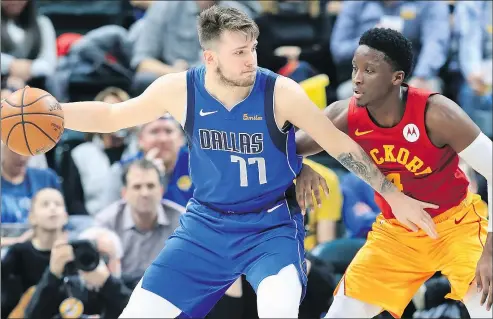  ?? — GETTY IMAGES ?? Dallas Mavericks rookie Luka Doncic (left) didn’t make our all-star cut, but Indiana Pacers’ Victor Oladipo did.