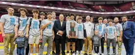  ?? LEGACY CHRISTIAN ACADEMY / CONTRIBUTE­D ?? The Legacy Christian wrestling team led by coach Michael Sizemore (center) and three-time individual champion Dillon Campbell (holding trophy) won its third straight Division III state team title Sunday.